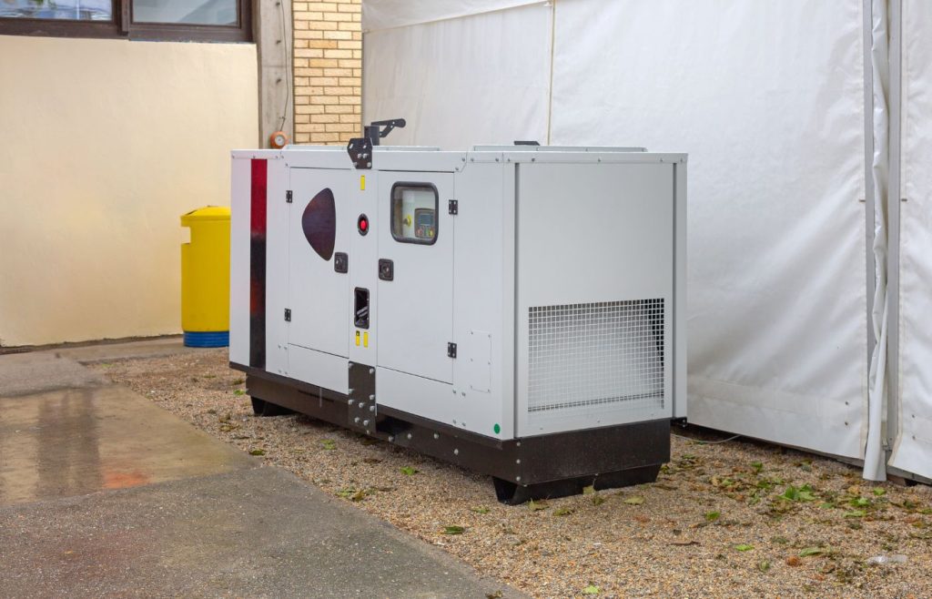 Silent diesel generator installed outside a commercial building in South Africa, offering low-noise backup power for business continuity during load shedding.